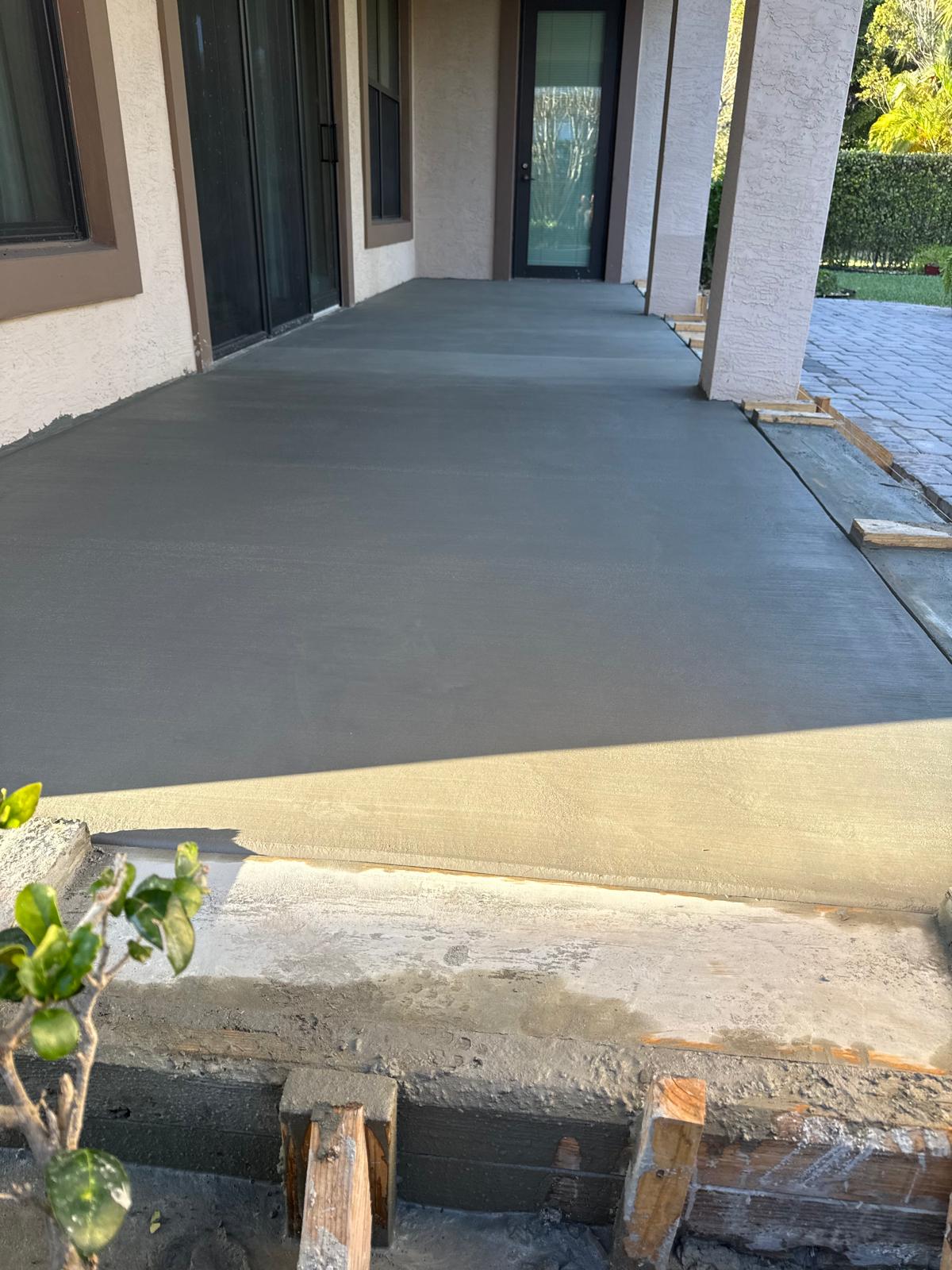 Crew finishing concrete slab - LMV Construction